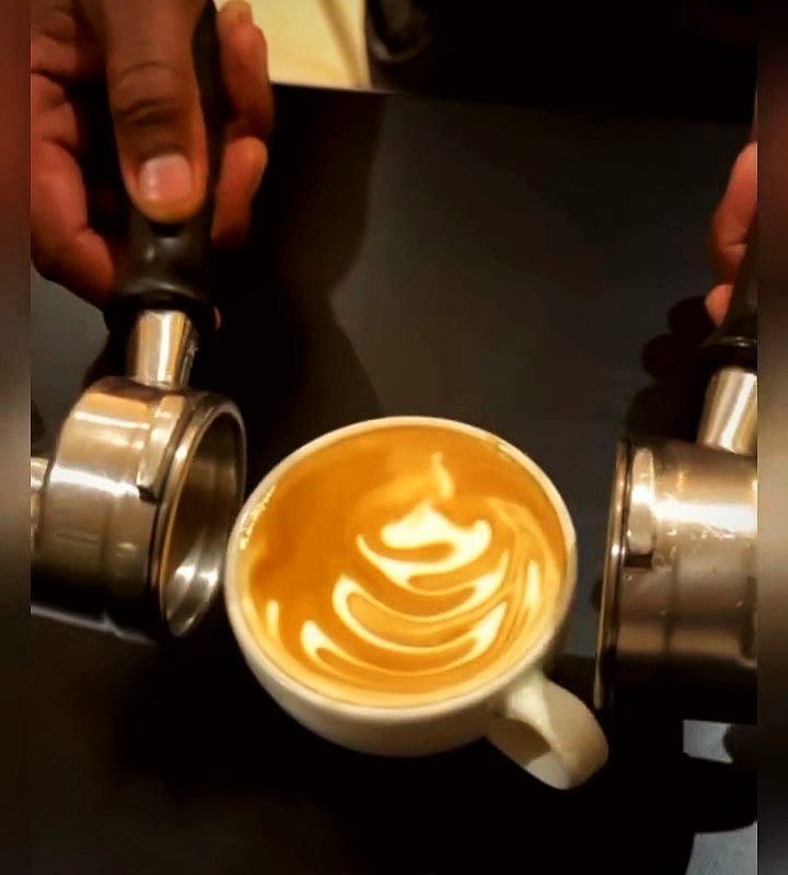 A flat white with rosetta latte art