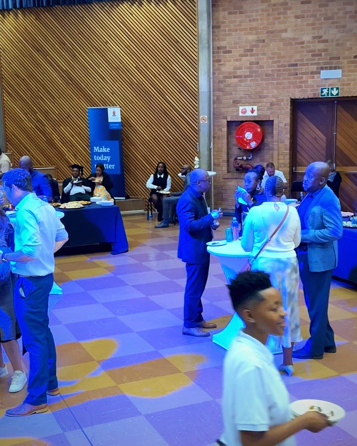 Guests mingling at a certificate ceremony catered by Artisan